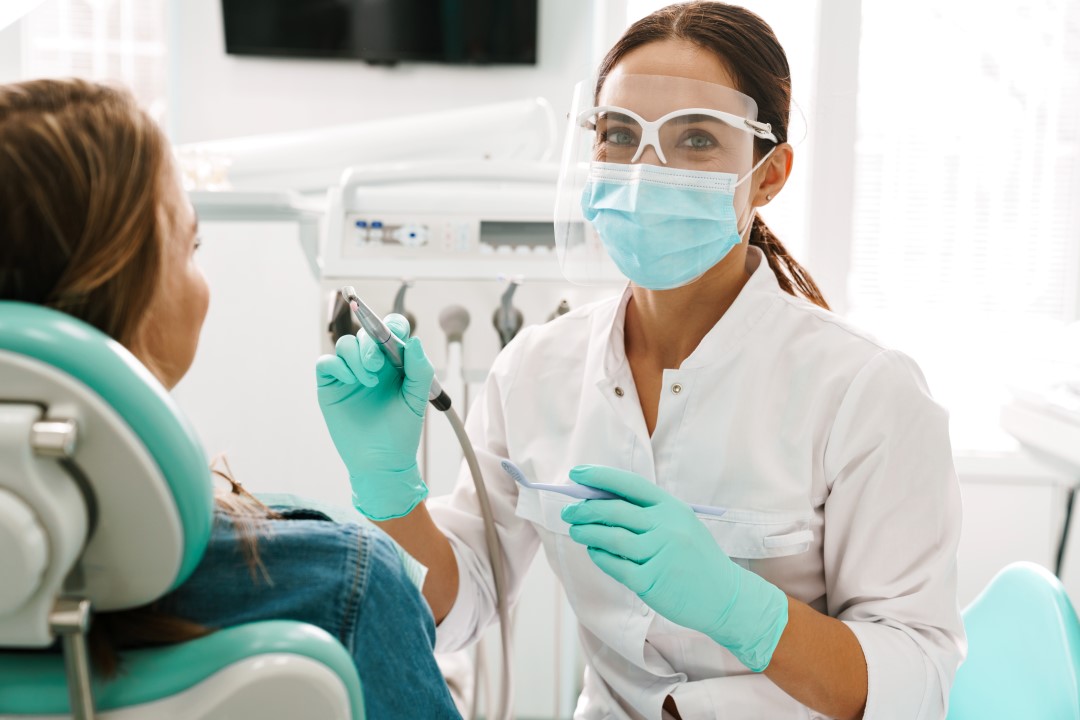 Dentist examining patient in New Westminster